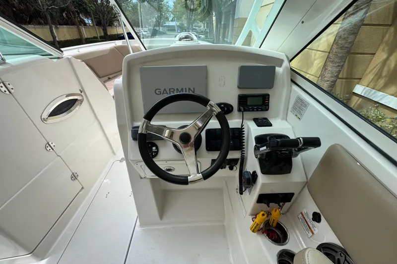 Slide: The Image of 2018 Sailfish 275 DC boat helm with Garmin navigation and control panel. - 16