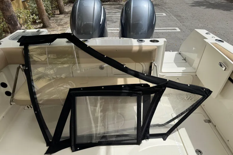 Slide: The Image of Open storage compartment on a 2018 Sailfish 275 DC boat, showing interior details. - 27