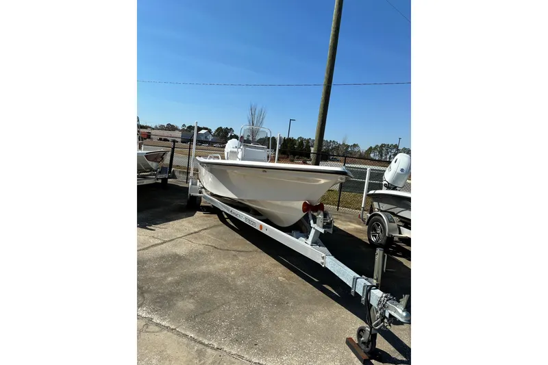 The Image of 2024 ALK2 Powerboats 21BHX on trailer, parked outdoors under clear blue sky. - 1
