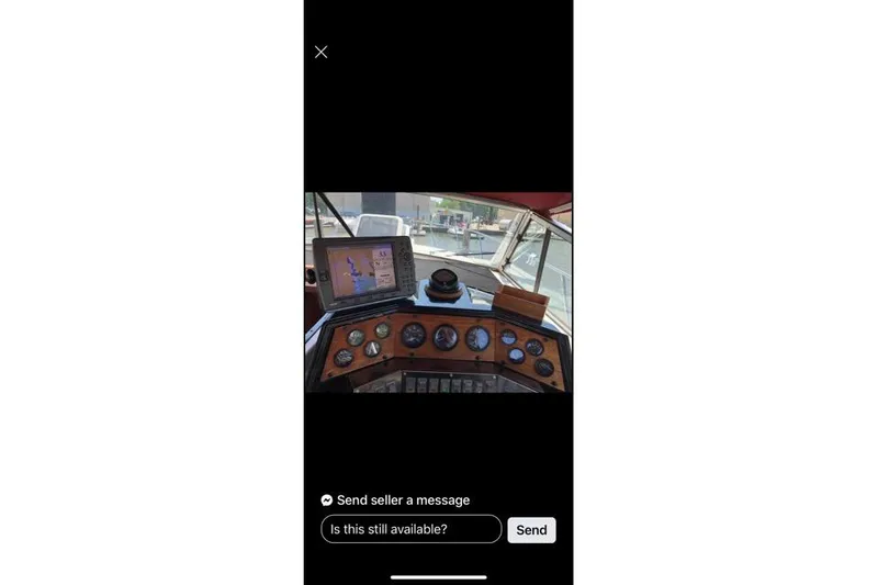 Slide: The Image of 1986 Wellcraft 3200 St. Tropez boat kitchen with sink, microwave, and fridge. - 18