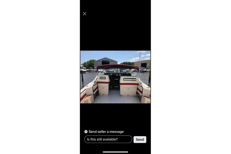 Slide: The Image of 1986 Wellcraft 3200 St. Tropez boat interior at marina, featuring spacious seating. - 3