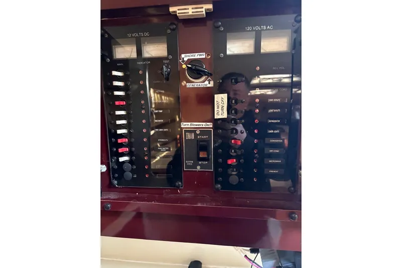 Slide: The Image of Electrical panel of a 1986 Wellcraft 3200 St. Tropez boat, showing switches and meters. - 8