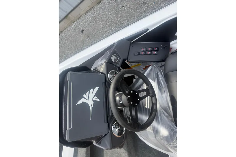 Slide: The Image of Steering console of 2026 Skeeter ZXR21 SE boat with control panel and gauges. - 13