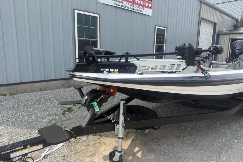 Slide: The Image of 2026 Skeeter ZXR21 SE boat with Minn Kota Ultrex motor on trailer. - 4