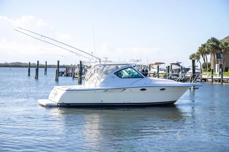 Slide: The Image of 2007 Tiara Yachts 3000 Open cruising in a serene marina setting. - 2