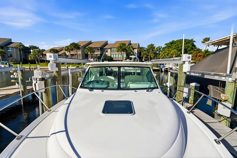 Slide: The Image of 2007 Tiara Yachts 3000 Open docked at marina with waterfront view. - 20