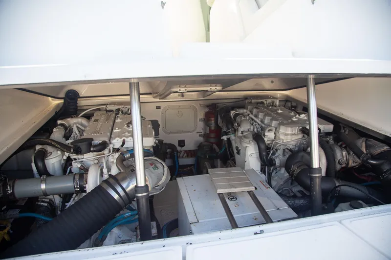 Slide: The Image of Engine compartment of a 2007 Tiara Yachts 3000 Open, showcasing dual engines and mechanical components. - 23