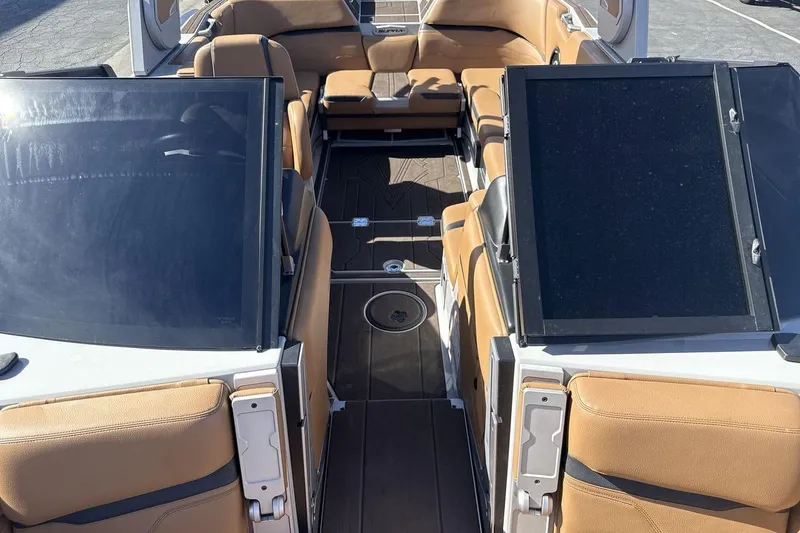 Slide: The Image of 2024 Supra SV boat interior with tan leather seats and sleek design. - 12