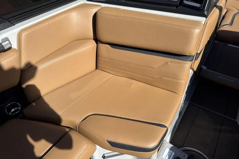 Slide: The Image of 2024 Supra SV boat interior with tan leather seating and modern design. - 17