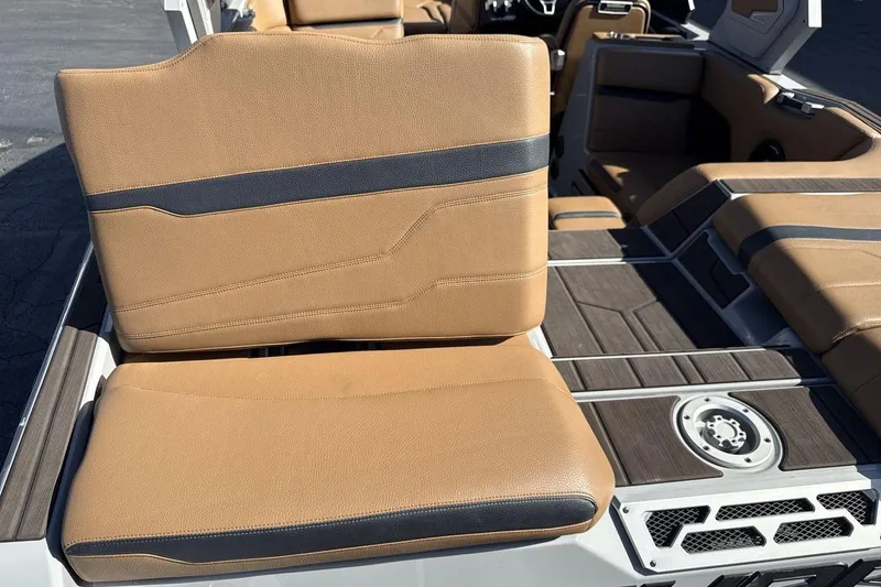 Slide: The Image of 2024 Supra SV boat interior with tan and black seating, featuring sleek design and modern finishes. - 19
