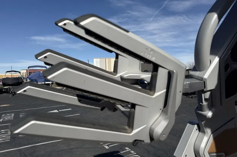 Slide: The Image of 2024 Supra SV boat rack in a parking lot under clear blue sky. - 22