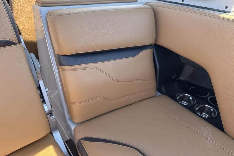 Slide: The Image of 2024 Supra SV interior with tan leather seats and cup holders. - 25