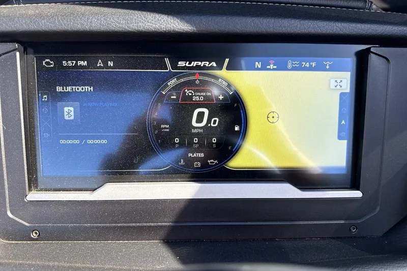 Slide: The Image of 2024 Supra SV dashboard display showing speedometer, Bluetooth connectivity, and navigation features. - 26
