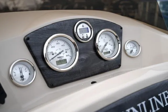 Slide: The Image of Dashboard of 2021 Harris Sunliner 230 boat with speedometer and gauges. - 13