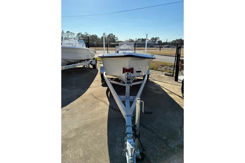 The Image of 2023 Stott Craft SCV 170 boat on trailer in outdoor lot. - 1
