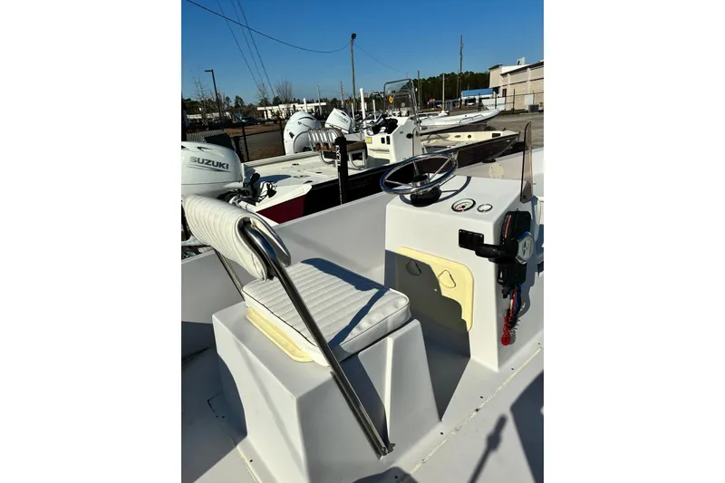 Slide: The Image of 2023 Stott Craft SCV 170 boat interior with steering wheel and controls. - 4