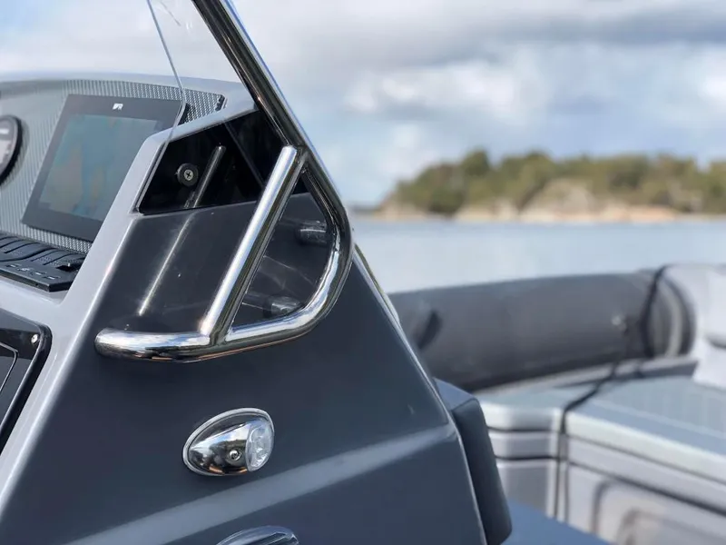 Slide: The Image of 2024 Northstar Orion 6 boat dashboard with scenic water background. - 9