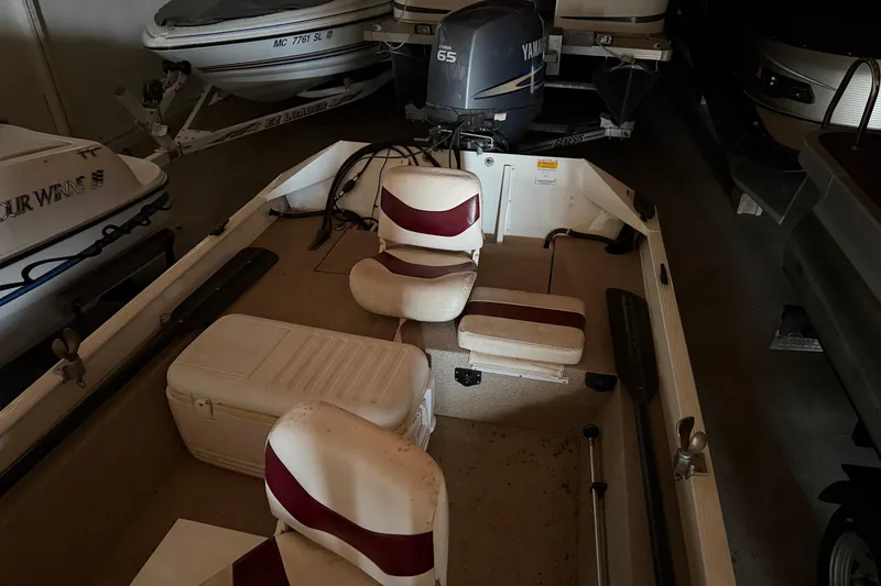 Slide: The Image of 2009 G3 1860 CC Deluxe boat interior with Yamaha 65 engine in storage. - 10