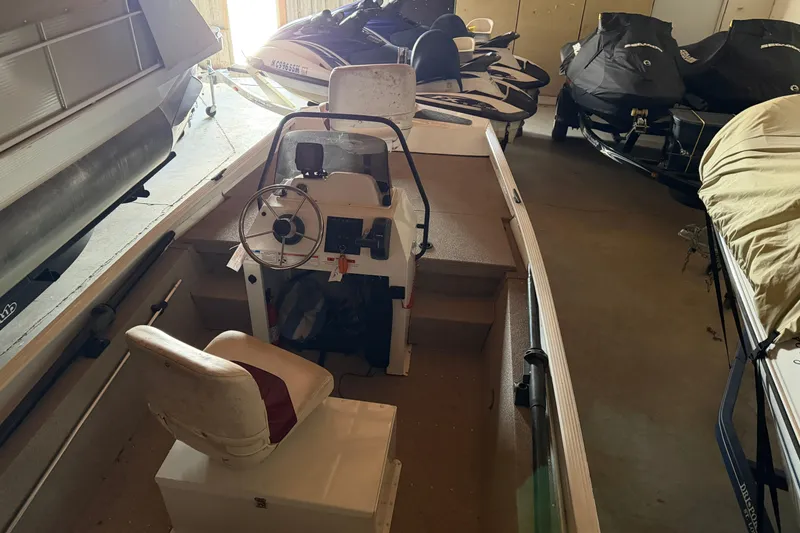 Slide: The Image of 2009 G3 1860 CC Deluxe boat interior with steering console and seating. - 12