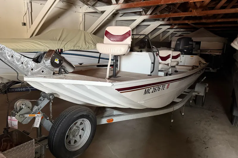 Slide: The Image of 2009 G3 1860 CC Deluxe boat in storage, on trailer, with covered boats nearby. - 3