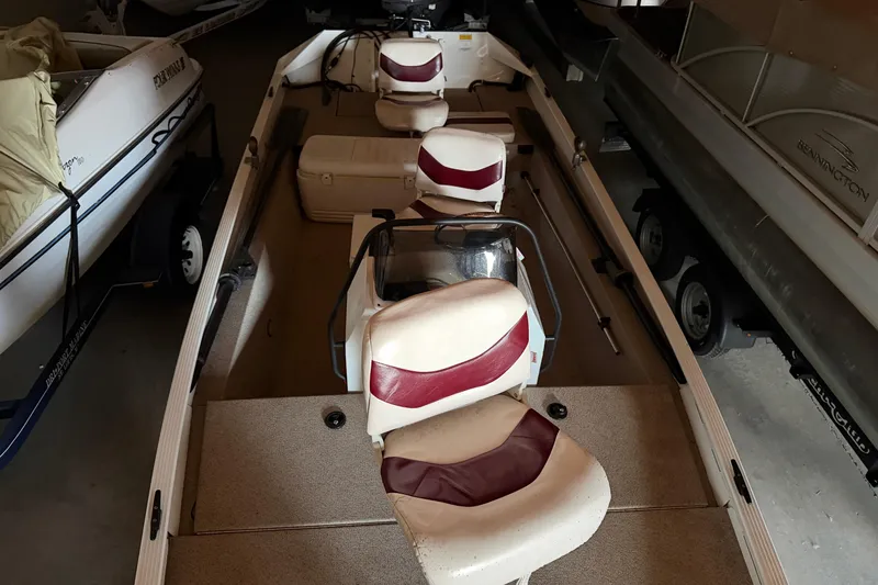 Slide: The Image of 2009 G3 1860 CC Deluxe boat interior with red and white seating. - 8