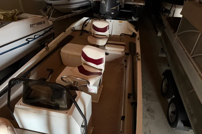 Slide: The Image of 2009 G3 1860 CC Deluxe boat interior with steering console and seating. - 9