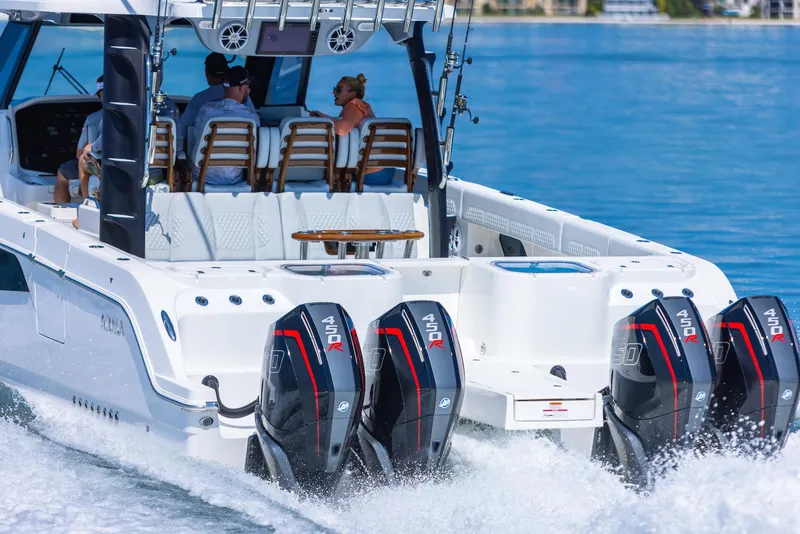 Slide: The Image of 2024 Aquila 47 Molokai boat cruising with powerful outboard engines. - 10