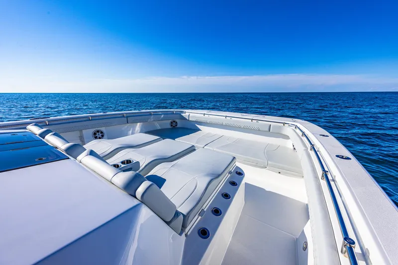 Slide: The Image of 2024 Aquila 47 Molokai boat on open sea, featuring spacious deck and luxurious seating. - 25