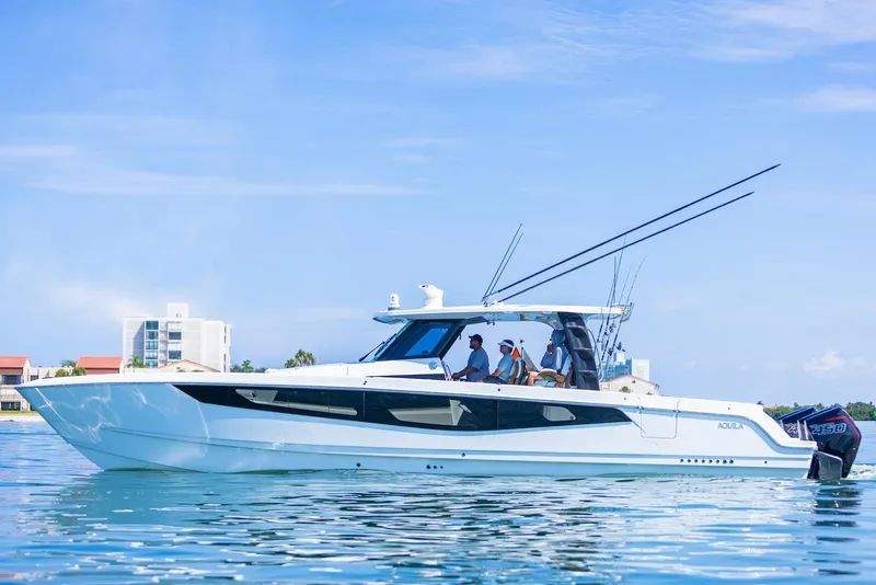Slide: The Image of 2024 Aquila 47 Molokai yacht on calm water, featuring sleek design and modern amenities. - 32