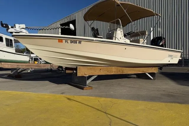 The Image of 2016 Pathfinder 2200 TRS boat with canopy on display outdoors. - 0