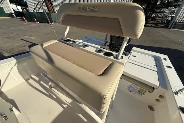 Slide: The Image of 2016 Pathfinder 2200 TRS boat interior with beige seating and cup holders. - 11