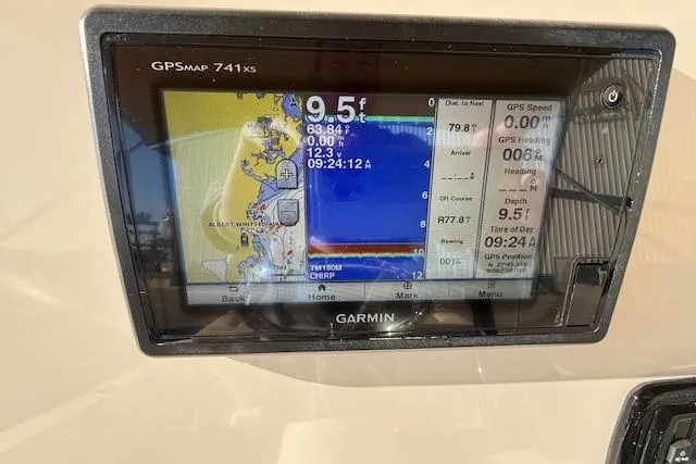 Slide: The Image of Garmin GPSMAP 741xs display on 2016 Pathfinder 2200 TRS boat, showing navigation and depth data. - 18