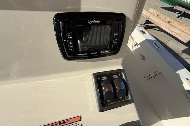 Slide: The Image of Control panel on a 2016 Pathfinder 2200 TRS boat, featuring Infinity audio system. - 19