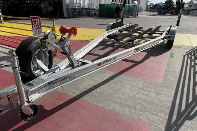 Slide: The Image of Trailer for 2016 Pathfinder 2200 TRS boat in a forklift area. - 23