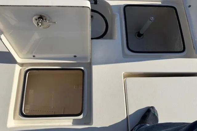 Slide: The Image of 2016 Pathfinder 2200 TRS boat storage compartments and deck view. - 25
