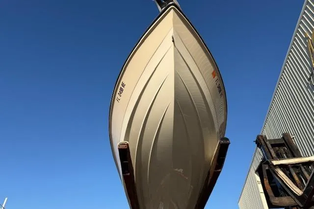 Slide: The Image of 2016 Pathfinder 2200 TRS boat hull viewed from below against clear blue sky. - 3