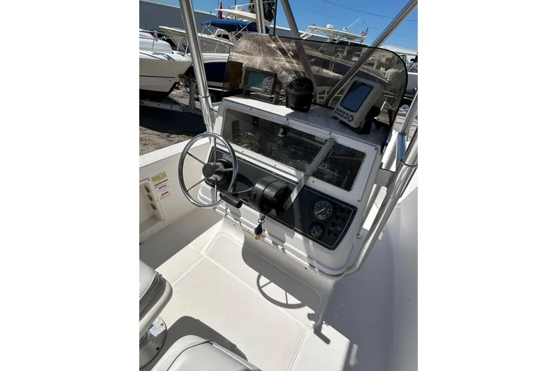 Slide: The Image of 1996 Wellcraft 190 CCF boat console with steering wheel and navigation equipment. - 10