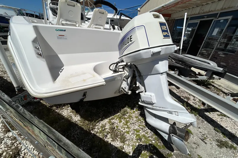 Slide: The Image of 1996 Wellcraft 190 CCF boat with Evinrude outboard motor on trailer. - 2