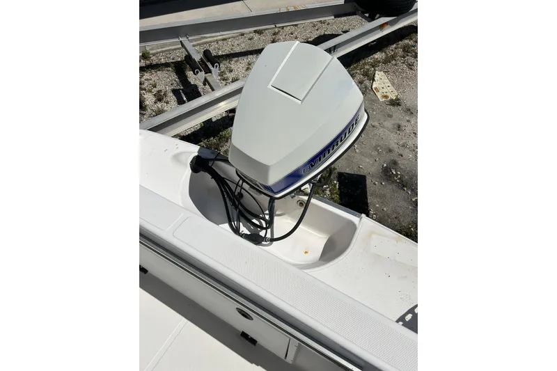 Slide: The Image of 1996 Wellcraft 190 CCF boat with Evinrude outboard motor on trailer. - 5