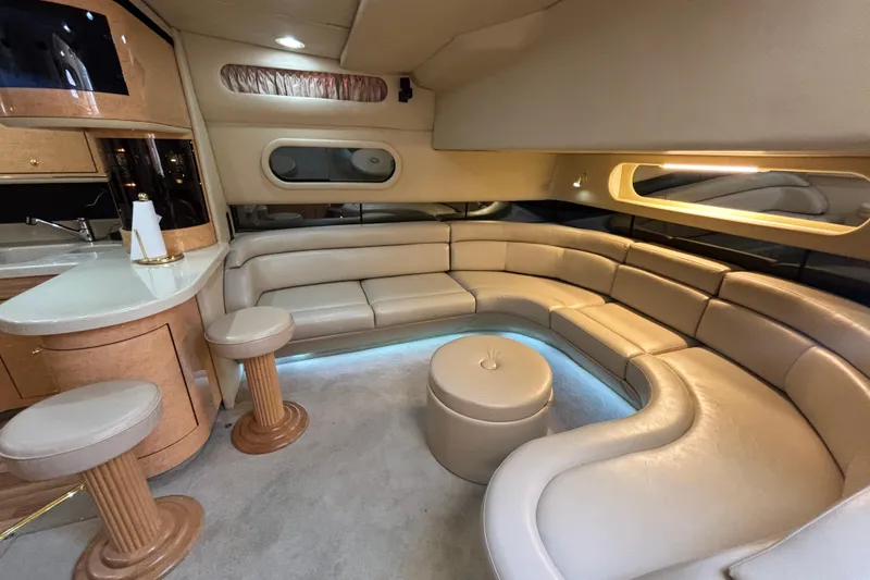 Slide: The Image of Luxurious interior of a 1998 Sea Ray 500 Sundancer yacht with plush seating and elegant design. - 14