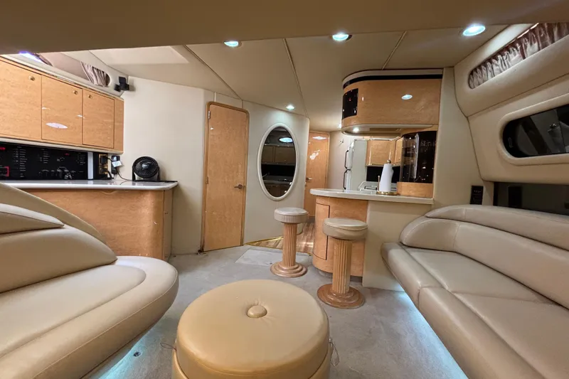 Slide: The Image of Luxurious interior of a 1998 Sea Ray 500 Sundancer yacht with elegant seating and cabinetry. - 17