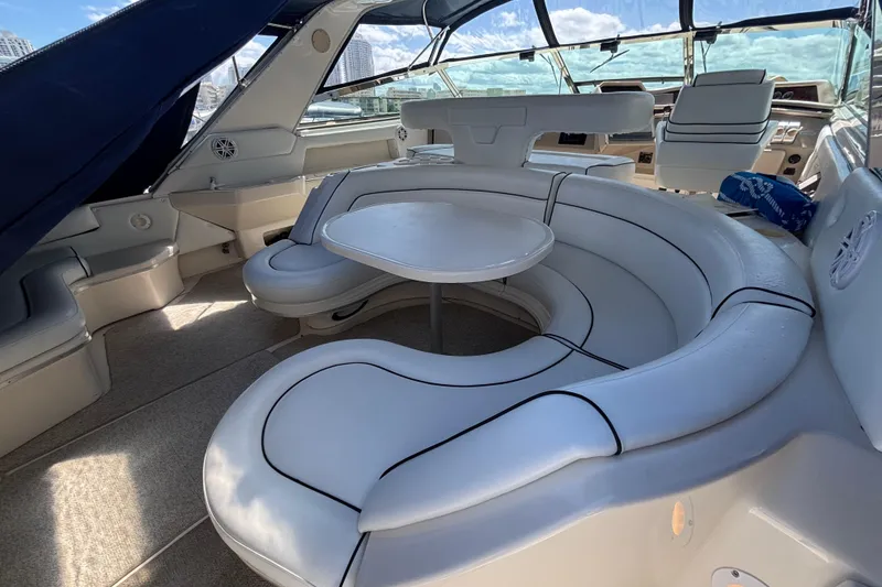 Slide: The Image of Luxurious interior of 1998 Sea Ray 500 Sundancer yacht with plush seating and table. - 2