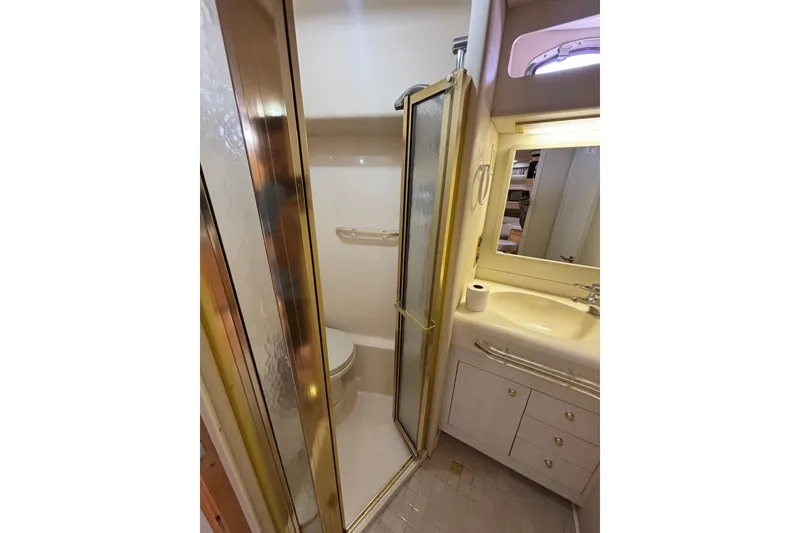 Slide: The Image of Bathroom interior of 1998 Sea Ray 500 Sundancer yacht with shower and vanity. - 22