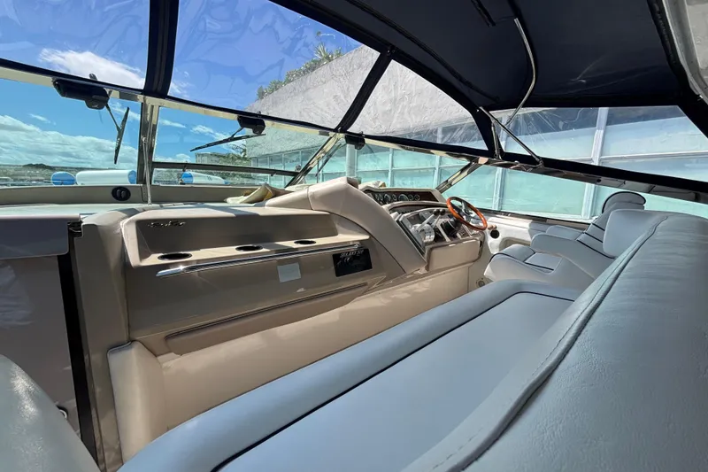 Slide: The Image of Interior view of 1998 Sea Ray 500 Sundancer yacht with sleek design and comfortable seating. - 4