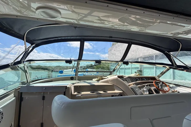 Slide: The Image of Interior view of 1998 Sea Ray 500 Sundancer yacht cockpit with steering wheel and dashboard. - 5
