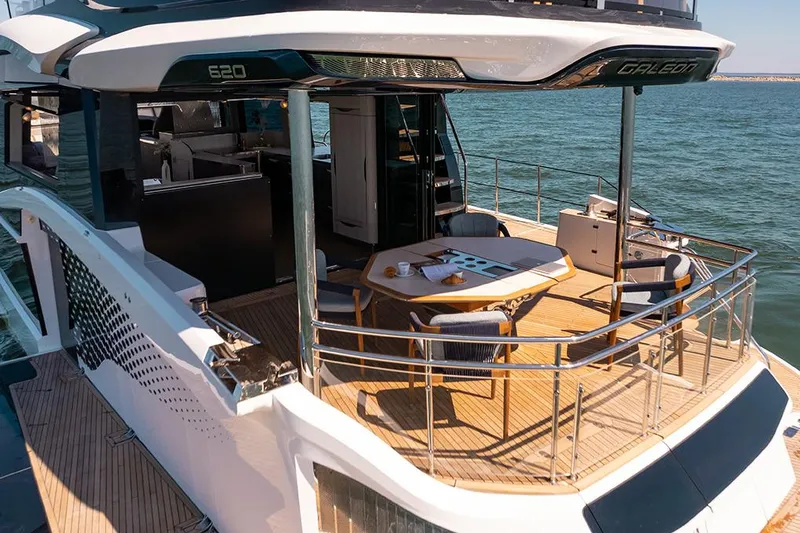 Slide: The Image of Manufacturer Provided Image: Luxurious 2025 Galeon 620 FLY yacht with elegant outdoor dining area on deck. - 4