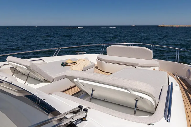 Slide: The Image of Manufacturer Provided Image: Luxurious 2025 Galeon 620 FLY yacht deck with sun loungers and ocean view. - 5