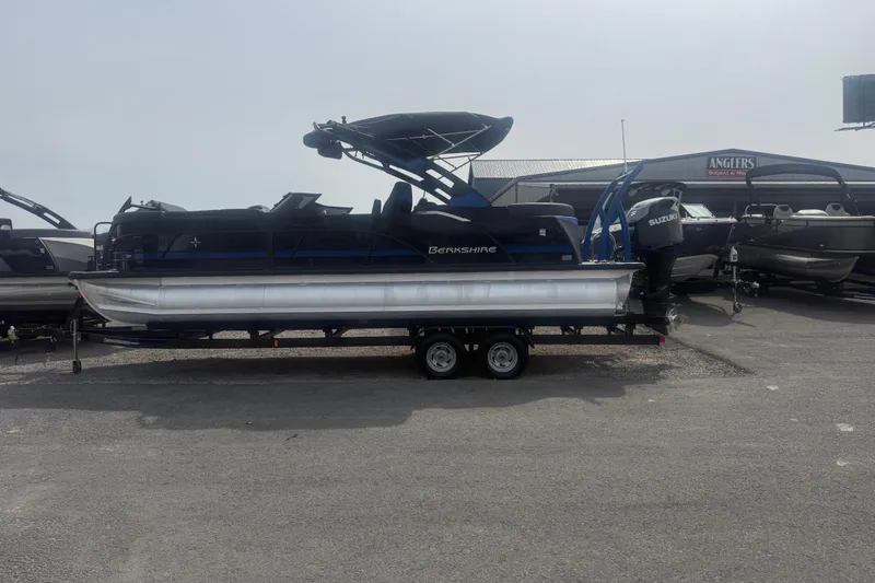 The Image of 2026 Berkshire 25RFX DC STS pontoon boat on trailer at dealership. - 1