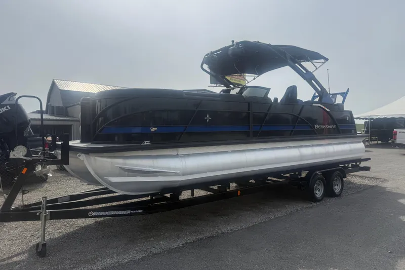 Slide: The Image of 2026 Berkshire 25RFX DC STS pontoon boat on trailer, outdoor setting. - 3