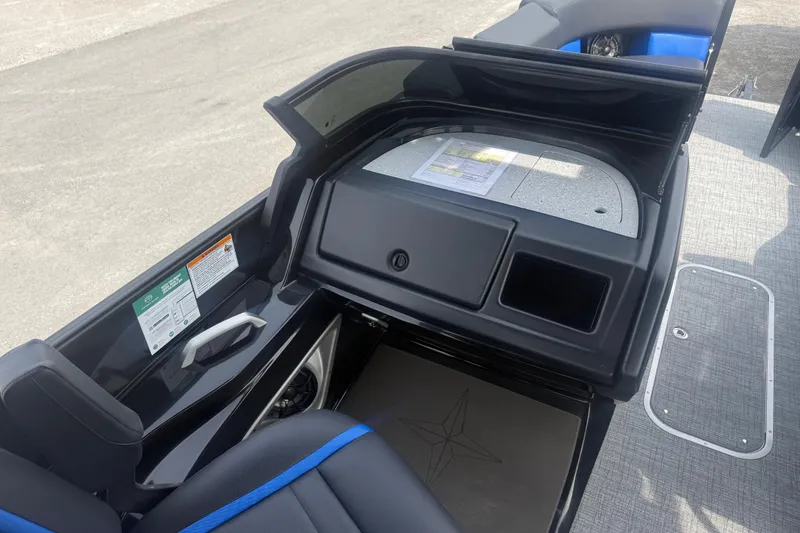 Slide: The Image of 2026 Berkshire 25RFX DC STS boat interior with storage compartment and seating area. - 8